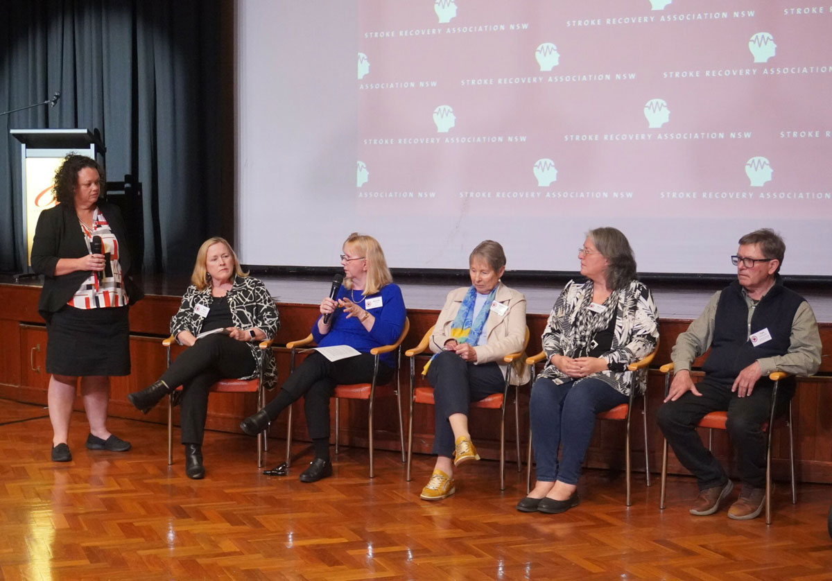 a group of 6 people talking about Stroke issues at a meeting